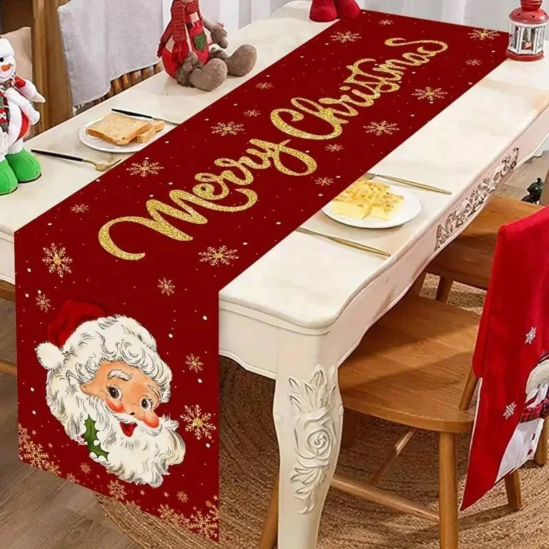 Red Christmas table runner with Santa Claus on a dining table